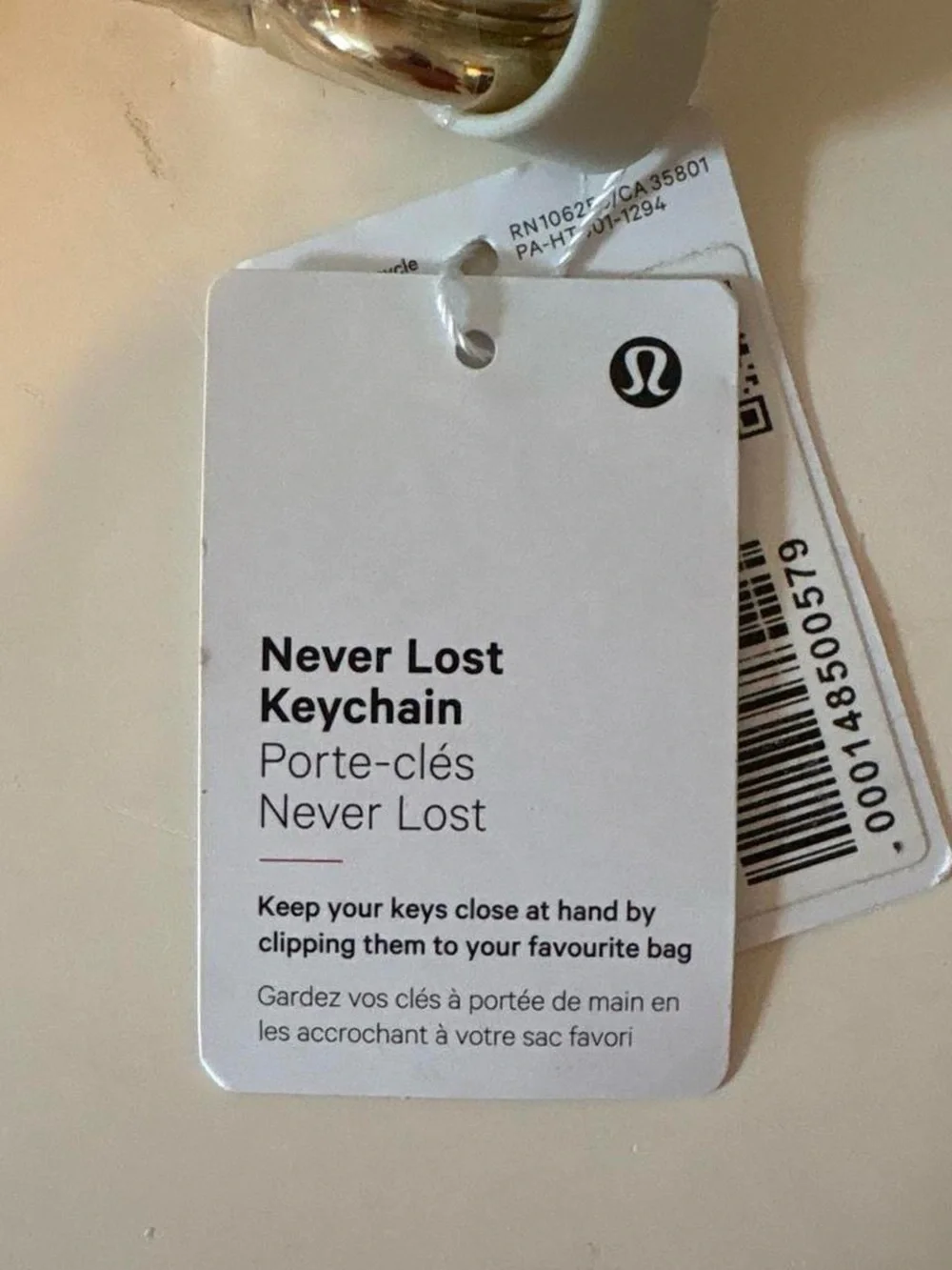 Lululemon Grey & Gold Never Lost Keychain